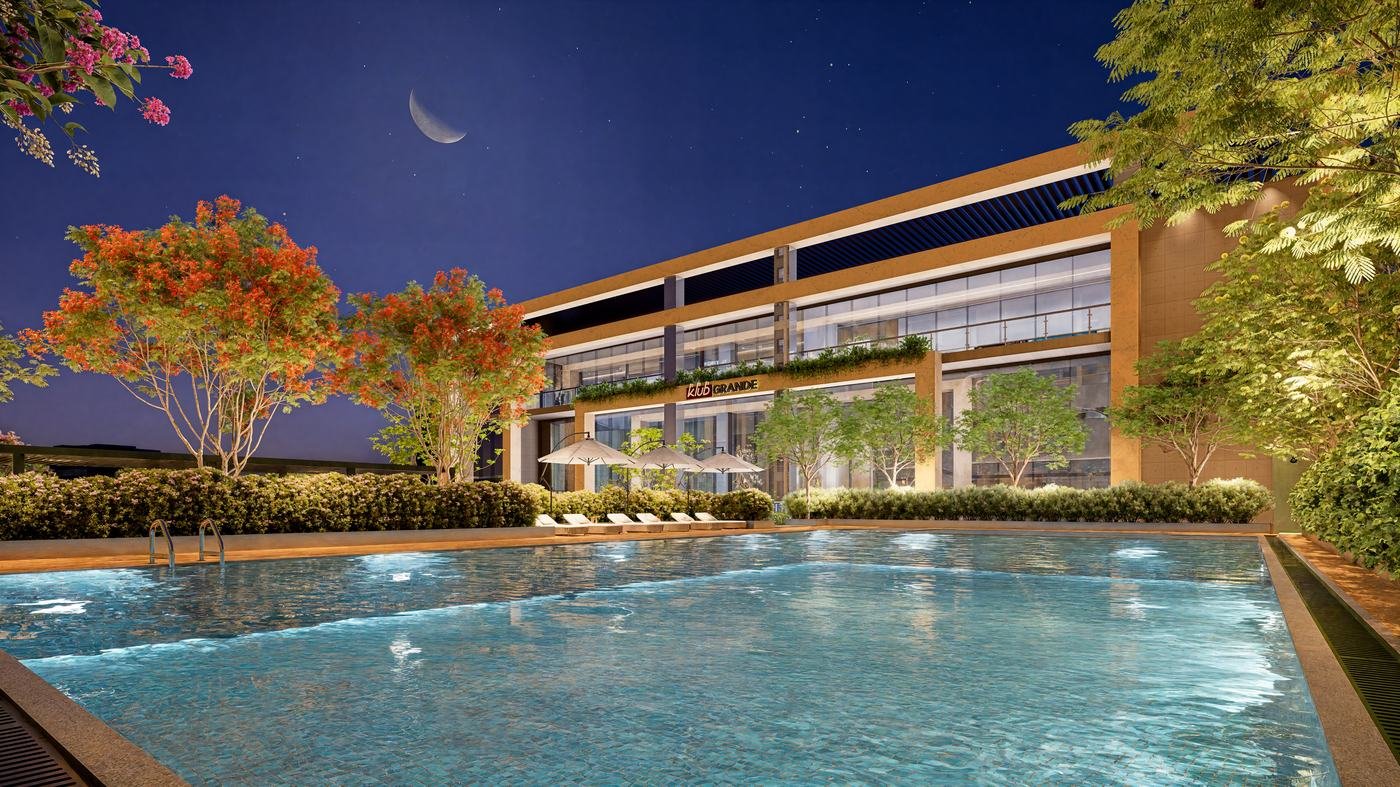 Infinity-edge swimming pool at Klub Grande clubhouse, Kohinoor Royale Towers, at night